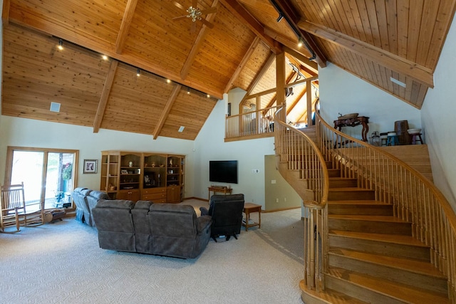 carpeted living room with rail lighting, beamed ceiling, a ceiling fan, and wood ceiling