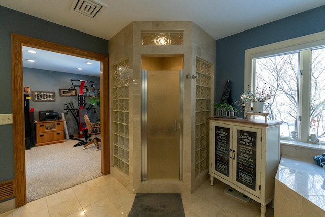 bathroom with tile patterned floors, recessed lighting, a stall shower, and visible vents