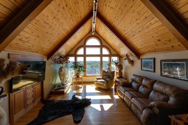 living room with vaulted ceiling with beams, light wood-style floors, and wood ceiling