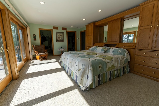 bedroom with access to outside, recessed lighting, and light colored carpet