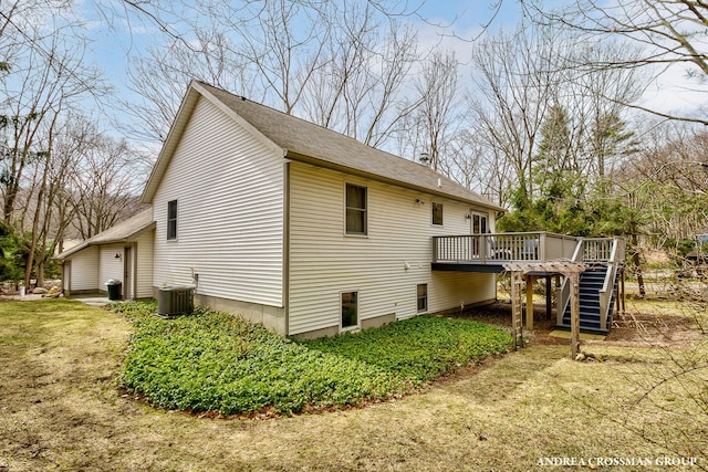 rear view of property featuring cooling unit, stairway, and a wooden deck