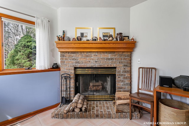 interior details featuring baseboards and a fireplace