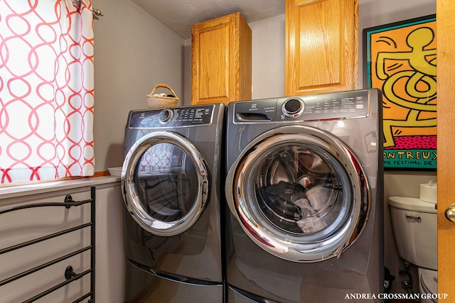 laundry area featuring cabinet space and washing machine and dryer