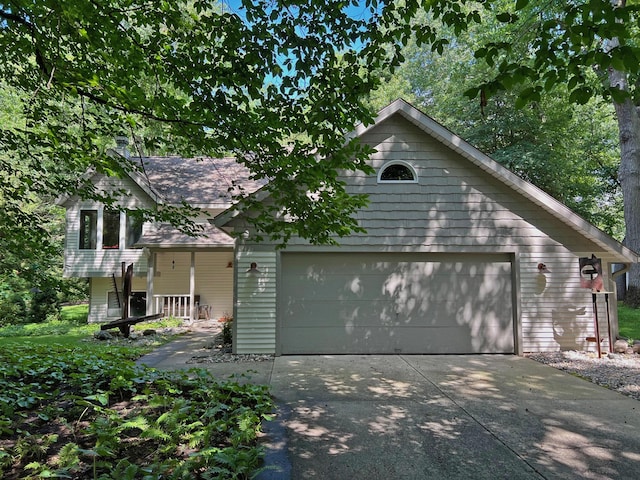 exterior space with driveway and a garage