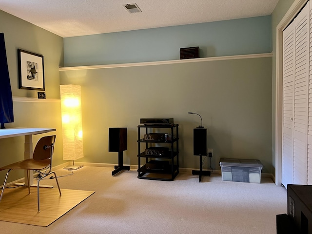 carpeted office featuring baseboards and visible vents