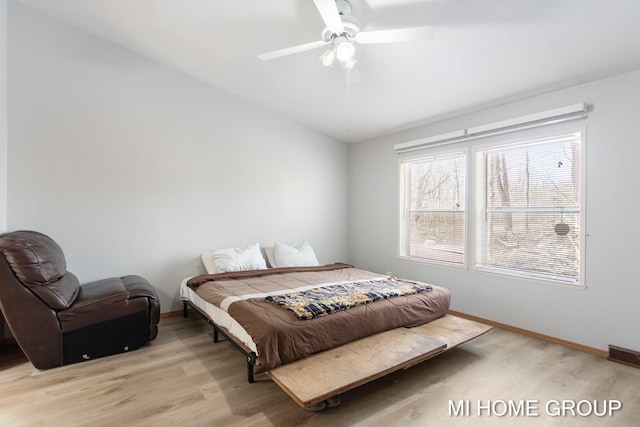 13879 49th St, Grand Junction, MI 49056 - bedroom with vaulted ceiling, baseboards, light wood-style floors, visible vents, and a ceiling fan