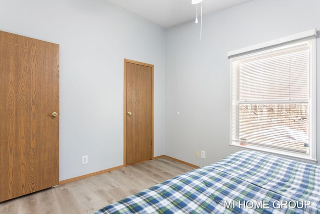 13879 49th St, Grand Junction, MI 49056 - unfurnished bedroom with baseboards and wood finished floors