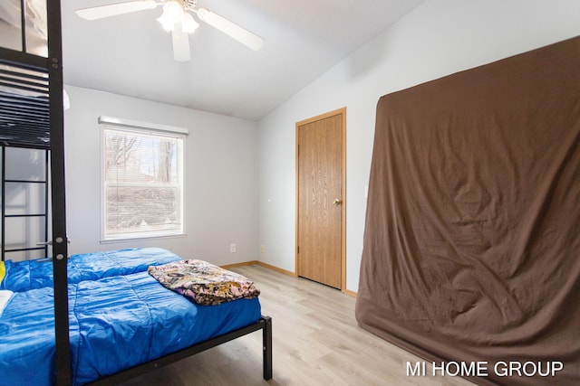 13879 49th St, Grand Junction, MI 49056 - bedroom featuring light wood-style flooring, baseboards, lofted ceiling, and ceiling fan