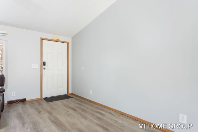 13879 49th St, Grand Junction, MI 49056 - entrance foyer with baseboards, visible vents, wood finished floors, and lofted ceiling