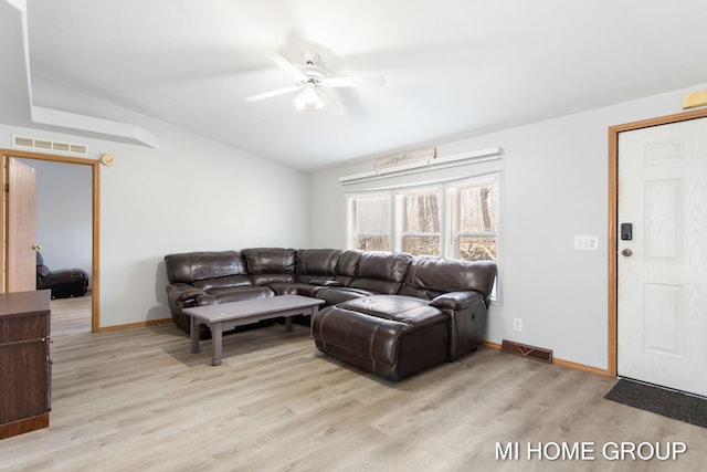 13879 49th St, Grand Junction, MI 49056 - living area featuring light wood-type flooring, vaulted ceiling, ceiling fan, and visible vents