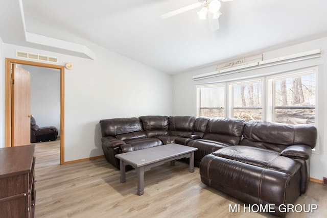 13879 49th St, Grand Junction, MI 49056 - living room featuring vaulted ceiling, a ceiling fan, light wood finished floors, baseboards, and visible vents