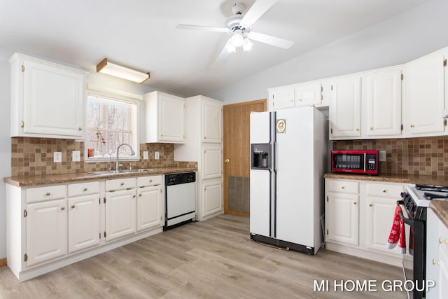 13879 49th St, Grand Junction, MI 49056 - kitchen with a sink, lofted ceiling, light wood-style flooring, white appliances, and white cabinets