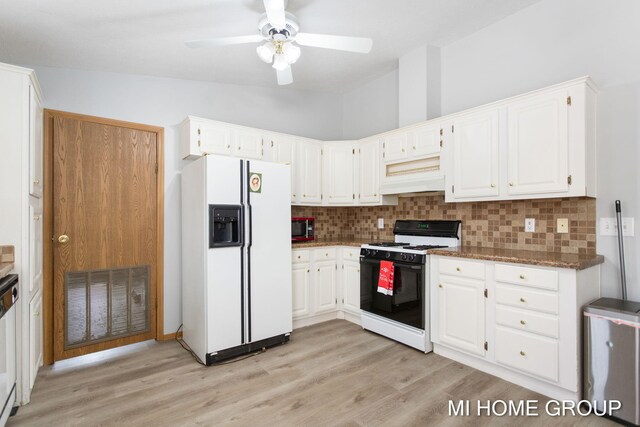 13879 49th St, Grand Junction, MI 49056 - kitchen with gas stove, decorative backsplash, visible vents, and white fridge with ice dispenser