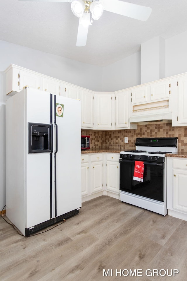 13879 49th St, Grand Junction, MI 49056 - kitchen with decorative backsplash, light wood-style flooring, range with gas cooktop, custom range hood, and white refrigerator with ice dispenser