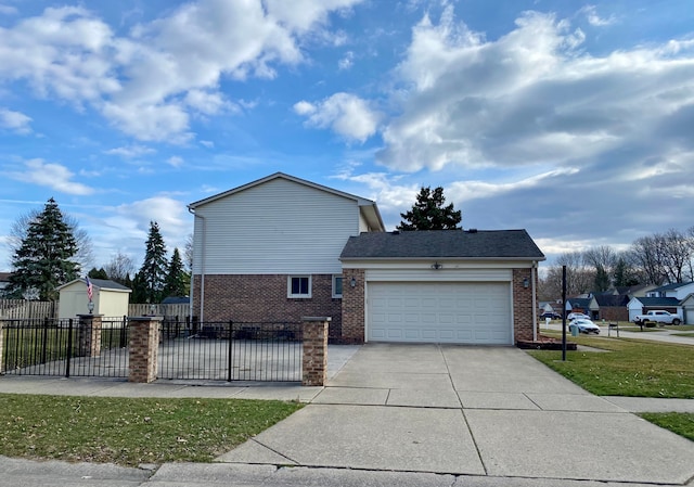 view of property exterior featuring a storage shed, concrete driveway, an attached garage, fence private yard, and brick siding