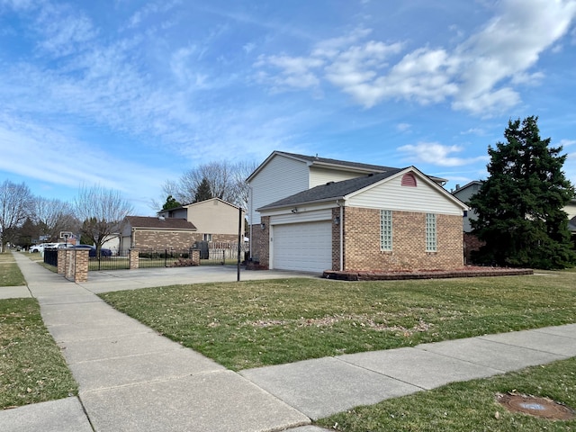 view of side of property with concrete driveway, fence, brick siding, a garage, and a yard