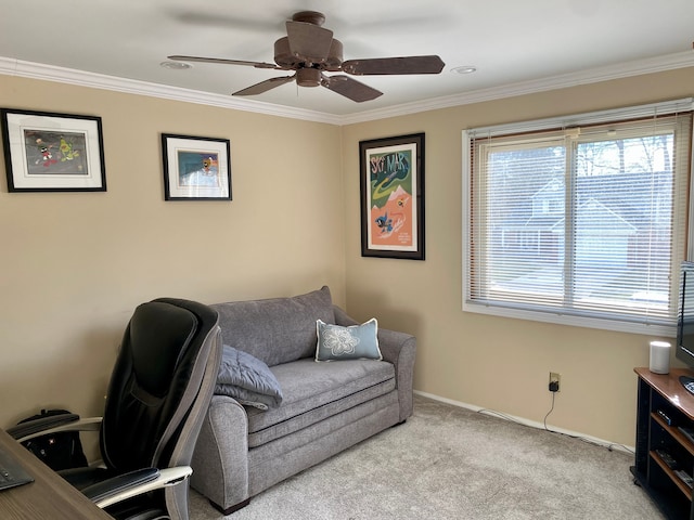 carpeted home office with a ceiling fan, baseboards, and ornamental molding