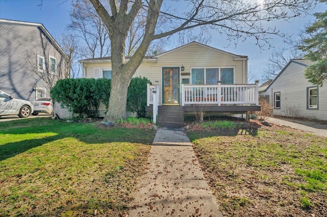 3034 Wolcott St, Ferndale, MI 48220 - bungalow-style house featuring a wooden deck and a front yard