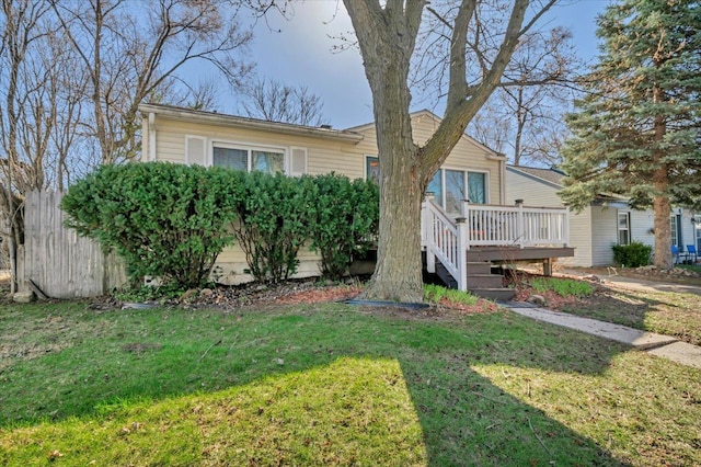 3034 Wolcott St, Ferndale, MI 48220 - view of front of property featuring a front lawn, fence, and a deck