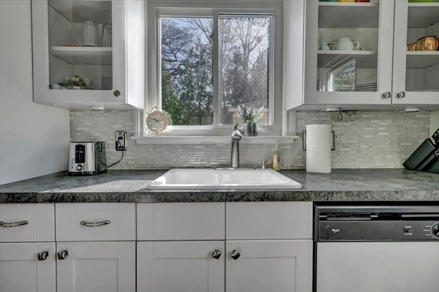 3034 Wolcott St, Ferndale, MI 48220 - kitchen featuring glass insert cabinets, a sink, white cabinetry, and dishwashing machine