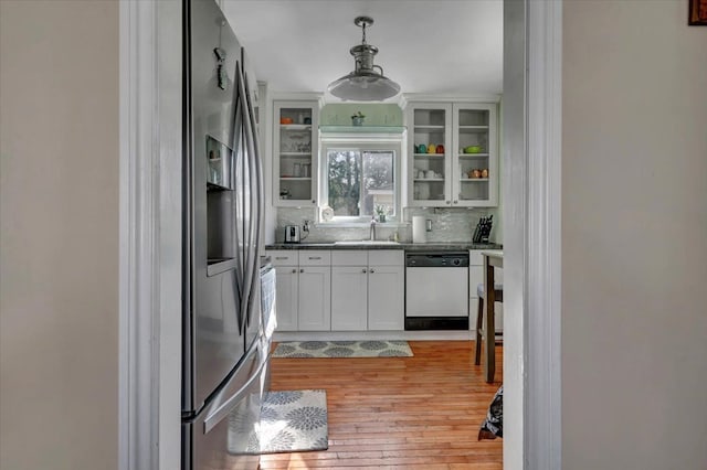 3034 Wolcott St, Ferndale, MI 48220 - kitchen featuring glass insert cabinets, white cabinets, light wood finished floors, dishwasher, and a sink