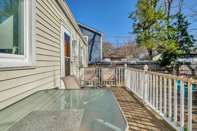 3034 Wolcott St, Ferndale, MI 48220 - wooden terrace featuring fence and outdoor dining area