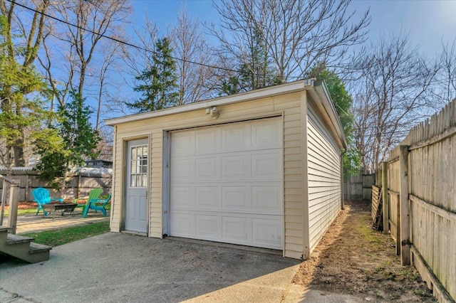 3034 Wolcott St, Ferndale, MI 48220 - garage featuring fence and driveway