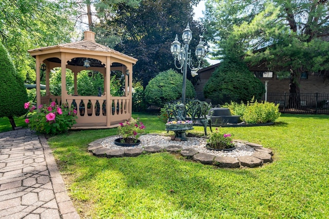 view of yard with a gazebo and fence