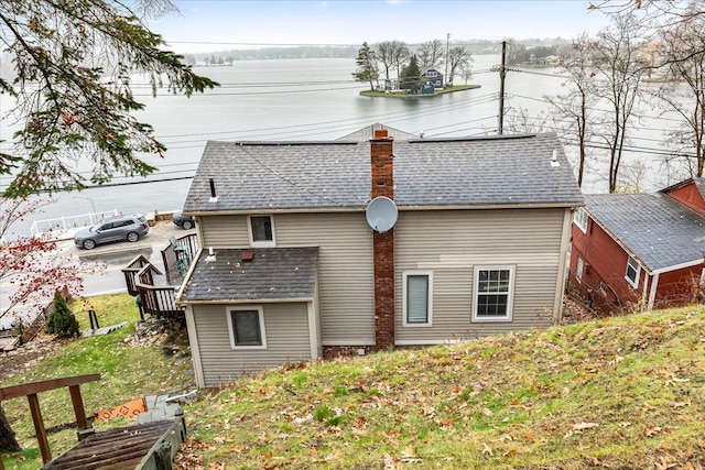 423 Heights Rd, Lake Orion, MI 48362 - back of house featuring a chimney and roof with shingles
