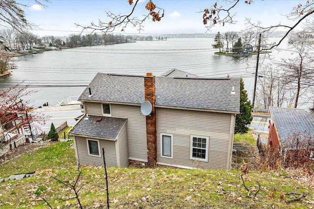 423 Heights Rd, Lake Orion, MI 48362 - rear view of property with roof with shingles, a chimney, and a water view