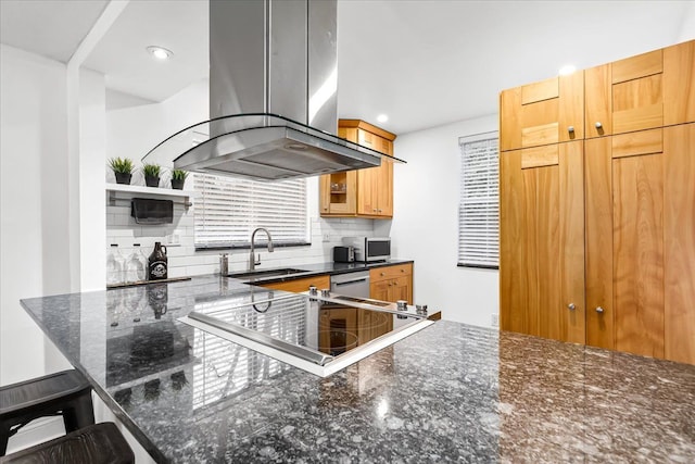 423 Heights Rd, Lake Orion, MI 48362 - kitchen featuring a sink, island exhaust hood, stainless steel microwave, black electric stovetop, and decorative backsplash