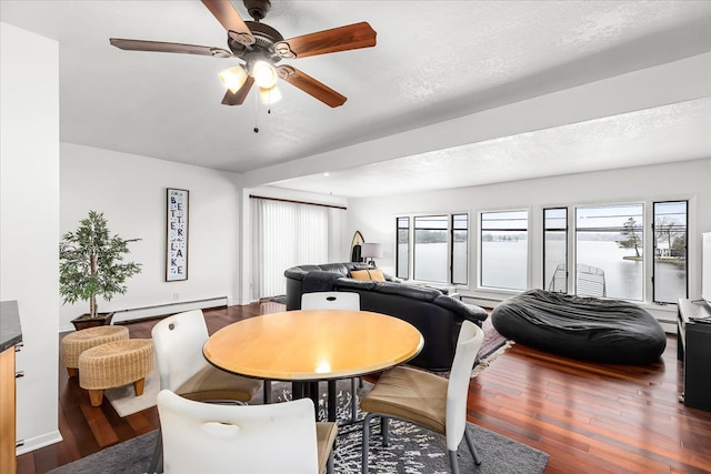 423 Heights Rd, Lake Orion, MI 48362 - dining space with a baseboard radiator, hardwood / wood-style flooring, and a ceiling fan