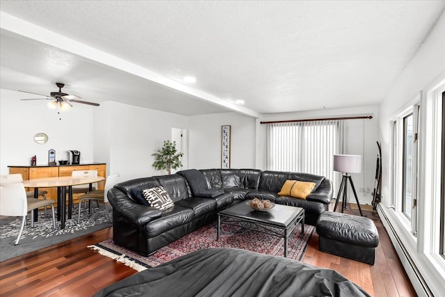 423 Heights Rd, Lake Orion, MI 48362 - living area with a baseboard radiator, hardwood / wood-style flooring, ceiling fan, and a textured ceiling