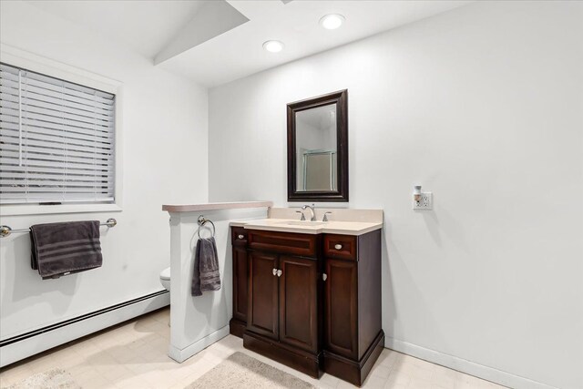 423 Heights Rd, Lake Orion, MI 48362 - bathroom featuring a baseboard radiator, toilet, baseboards, tile patterned floors, and recessed lighting