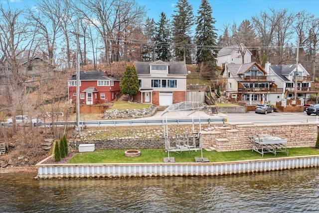 423 Heights Rd, Lake Orion, MI 48362 - rear view of house featuring a water view, an outdoor fire pit, a residential view, and brick siding