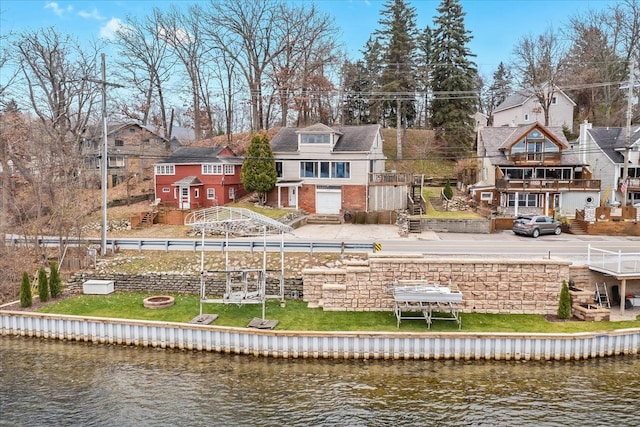 423 Heights Rd, Lake Orion, MI 48362 - back of house featuring a water view, a residential view, stairway, and brick siding