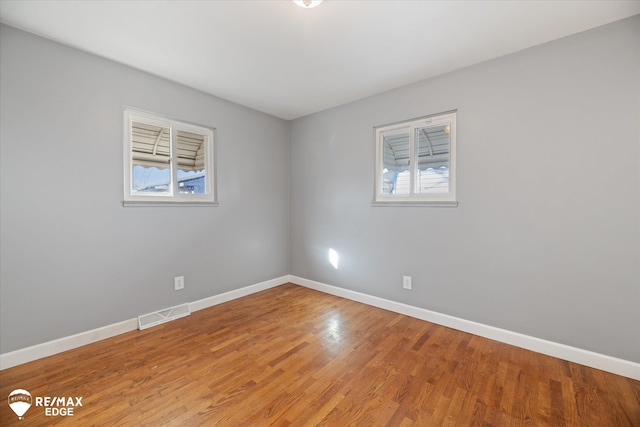 3738 Holly Ave, Flint, MI 48506 - empty room featuring healthy amount of natural light and light wood-type flooring