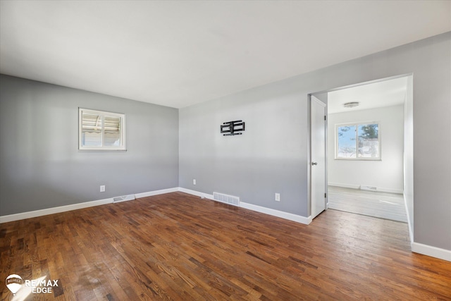 3738 Holly Ave, Flint, MI 48506 - spare room with wood finished floors and baseboards