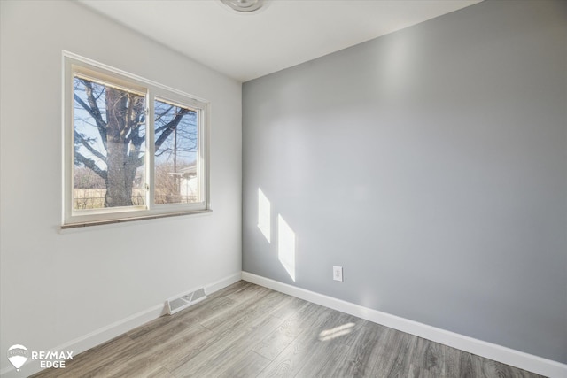 3738 Holly Ave, Flint, MI 48506 - spare room featuring wood finished floors and baseboards