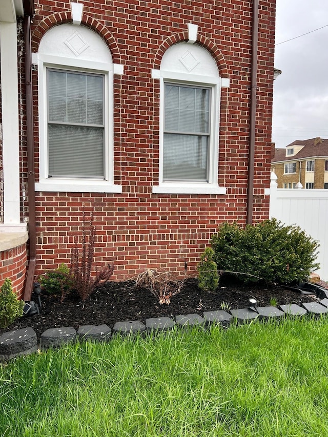 8451 La Salle Blvd, Detroit, MI 48206 - view of home's exterior featuring brick siding and fence