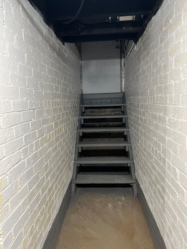 8451 La Salle Blvd, Detroit, MI 48206 - staircase with unfinished concrete flooring