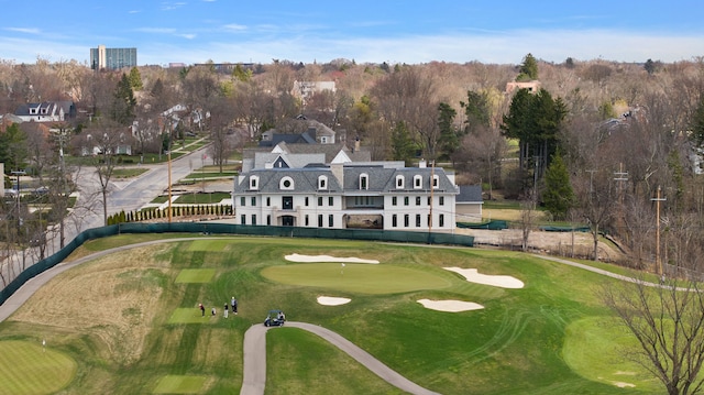 aerial view of a local golf course and a tree filled landscape