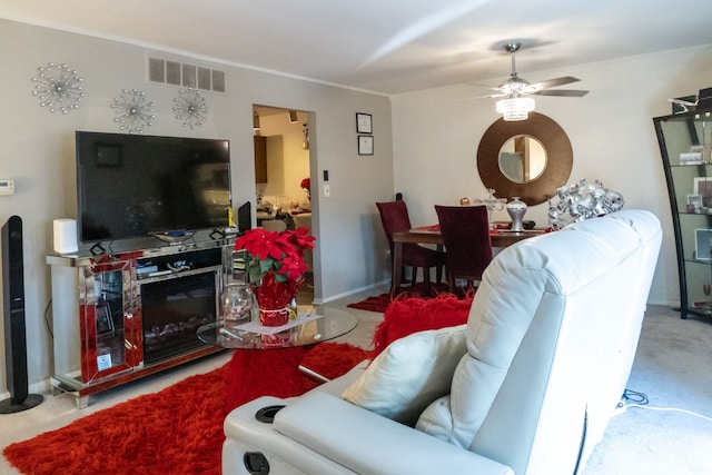 carpeted living room featuring a ceiling fan, baseboards, and visible vents