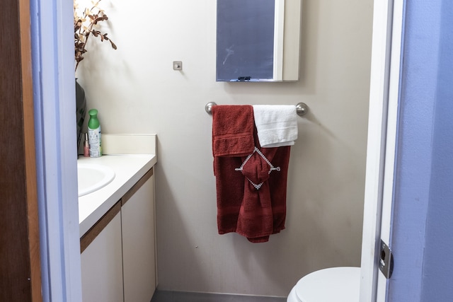 bathroom with toilet and vanity
