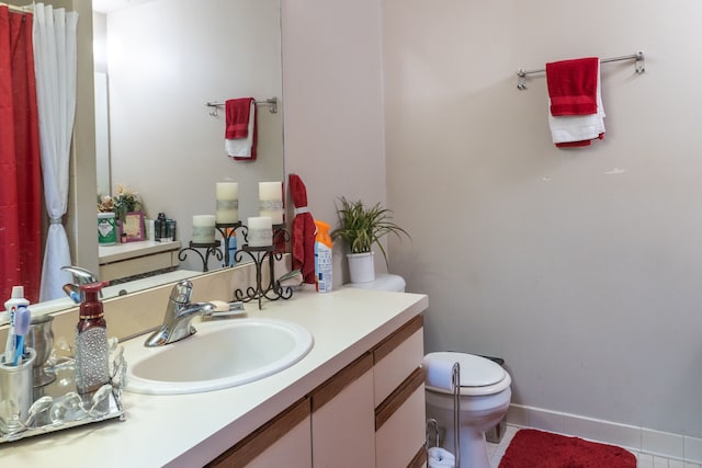 bathroom featuring baseboards, toilet, tile patterned floors, curtained shower, and vanity