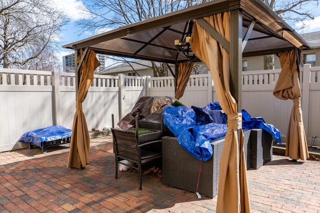 view of patio / terrace with a fenced backyard and a gazebo