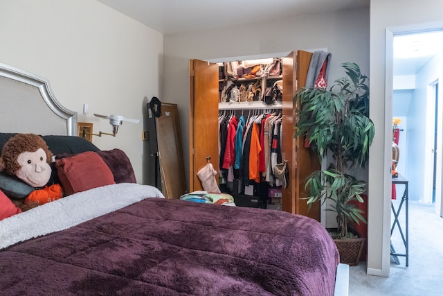 carpeted bedroom featuring a closet