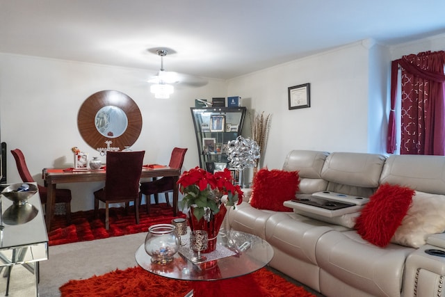 living area featuring carpet flooring and ceiling fan
