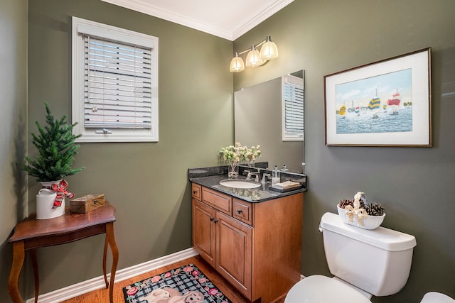 1615 Royal Birkdale Dr, Oxford, MI 48371 - half bathroom featuring baseboards, ornamental molding, toilet, wood finished floors, and vanity
