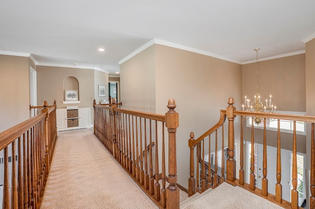 1615 Royal Birkdale Dr, Oxford, MI 48371 - hall featuring a notable chandelier, an upstairs landing, crown molding, and carpet